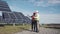 Workers walking in between rows of solar panels