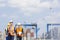 Workers walking in shipping yard