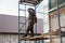 Workers walling the house with wall siding