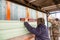 Workers walling the house with wall siding