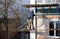 Workers walling the house with wall siding