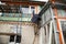 Workers walling the house with wall siding