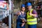 Workers in warehouse with thumb up.