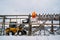 Workers on the wooden stockfish rack in winter.Lofoten, island, Nordland, Norway