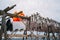 Workers on the wooden stockfish rack in winter.Lofoten, island, Nordland, Norway