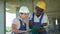 Workers working on building site with tablet