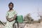 Working African ethnicity Infant getting pure Water in a natural environment