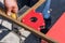 Working auxiliary tools in the hands of a worker welder. Using a magnetic welding angle in work to fix metal