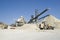 Working belt conveyors and a piles of rubble in Gravel Quarry