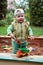 Working boy playing in a sandbox