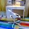 Working children`s table with a chair. Office supplies on the table