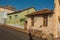 Working-class shabby colored houses in an empty street on a sunny day at San Manuel.