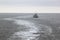 Working dredger in in Wadden Sea near Ameland island