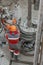 A working driller is screwing drill pipes to run into the well.