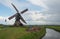 Working Dutch windmill in springtime