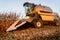 Working farmer using combine for harvesting corn. Working details of autumn harvest