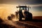 Working in a field, a tractor prepares the ground for planting and ploughs a field