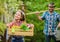 Working in green environment. ecology. Gardening tools. little girl and happy man dad. earth day. father and daughter on