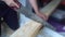 Working with a handsaw sawing a wooden board