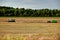 working harvester and following tractor