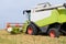 Working harvesting combine in field