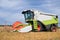 Working harvesting combine in field