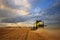 Working Harvesting Combine in the Field of Wheat