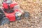 Working lawn mower mulching autumn leaves for lawn care in Texas, USA