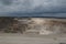 Working Limestone Quarry with Dark Clouds Overhead.