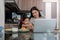 Working mom work from home office. businesswoman and cute child using laptop work freelancer workplace in home