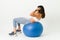 Working out with sit ups on an exercise ball