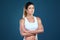 Working out to get in the best shape. Studio shot of a fit young woman posing against a blue background.