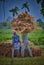 Working people, two man in the field,paddy cutter