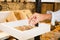 Working place at bakery, man hands picking piece of bread