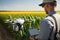 working scientist with agronomist drone for analysis and control of plant diseases