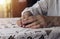 Working senior aged hands of woman after work closeup, lying on table