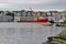 A working ship drives on the strait of Haugesund, Norway.