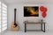 Working table in empty room with acoustic guitar and red balloons in 3D rendering