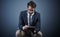 Working using modern technology. Studio shot of a handsome young businessman using a tablet while sitting on a chair