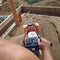 Working with a vibrating machine and equipment, soil compaction with a vibrating plate