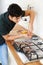 Workman Installing Gas Cooker In New Kitchen