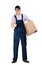 Workman in overalls hands a parcel box