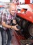 Workman polishing boots in workshop