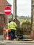 Workmen fixing telephone line on a Welsh street.