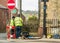 Workmen fixing telephone line on a Welsh street.