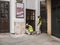 Workmen prepare wall for painting on Playhouse Theatre, London,
