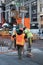 Workmen seen removing old paving slabs in New York City, USA.