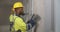 Workmen using tape measuring walls for home renovation