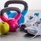 Workout concept on grey floor with sneakers and kettle bells