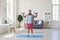 Workout fitness exercise sport at home. Funny fat man doing exercises sport in the room online at home.